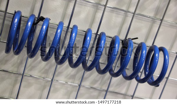 New blue\
car coil spring, automotive suspension\
part