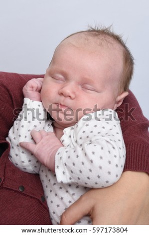 Similar – Image, Stock Photo Baby lies on a blanket and covers his eyes with his hands