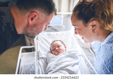 A New born baby boy resting in little bed in hospital - Powered by Shutterstock