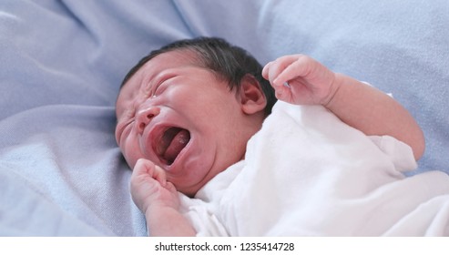 New Born Baby Crying On Bed