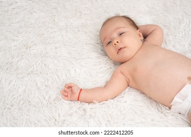 New Born Baby Girl On Texture Blanket, Lying On Blanket, Opened Eyes.