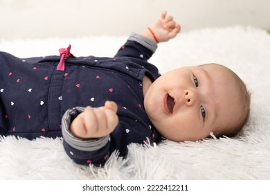 New Born Baby Girl On Texture Blanket, Lying On Blanket, Opened Eyes.