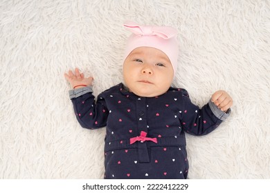 New Born Baby Girl On Texture Blanket, Lying On Blanket, Opened Eyes.