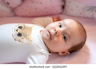 New Born Baby Girl On Texture Blanket, Lying In Bed Opened Eyes.