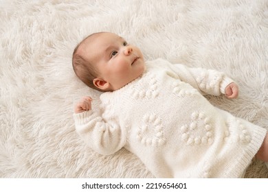 New Born Baby Girl Sleeping On Texture Blanket, Lying On Blanket, Opened Eyes, White Dress