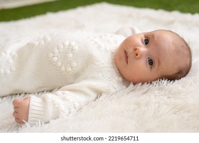 New Born Baby Girl Sleeping On Texture Blanket, Lying On Blanket, Opened Eyes, White Dress