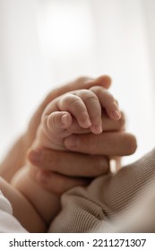 New born baby hand hold mum index finger. Mother and baby. - Shutterstock ID 2211271307