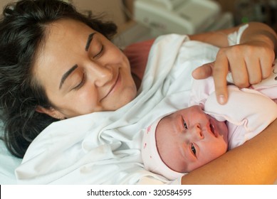 New Born Baby With Mother In Hospital