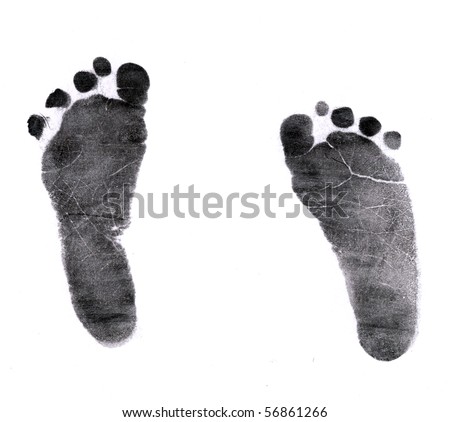 New born baby's foot print in black on white background.