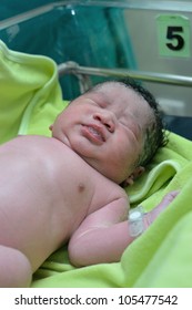 New Born Infant From Cesarean Section In Operating Theater.