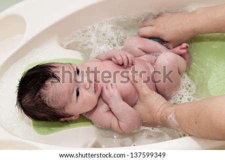 Similar – Newborn in the bathtub