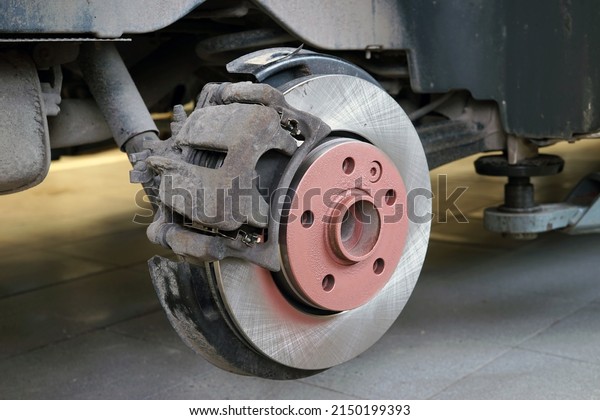 A new brake disc is installed\
on the car. The brake caliper is corroded. Selected\
focus.