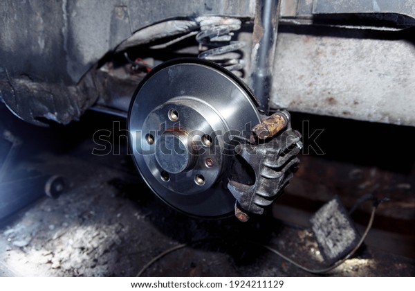 new\
brake disc on the wheel hub, brake system\
repair
