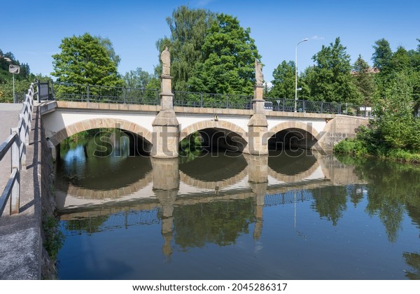 A new bridge across a small river. Summer time. Small reinforced ...