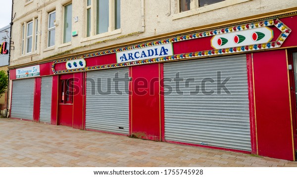 New Brighton, UK: Jun 3, 2020: A street view
shows the impact of Corona virus pandemic on businesses which are
required by law to close
temporarily.