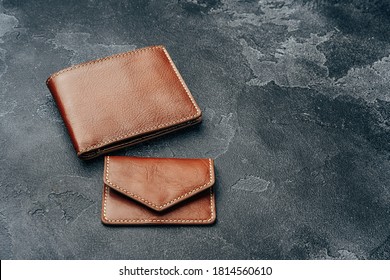 New brown leather wallet on dark background
