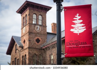 NEW BRUNSWICK, NEW JERSEY - February 26, 2018: College Hall And Commemorative Banner On Campus; Douglass College Celebrates 100 Year Anniversary