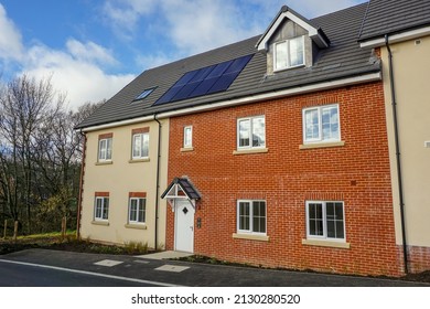 New Build Housing In The UK. Modern Houses And Flats On New Developed Street. Solar Panels On New Housing