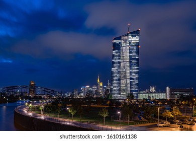 new building of the european central bank ECB in front of several bank towers from the skyline of the Frankfurt bank quarter