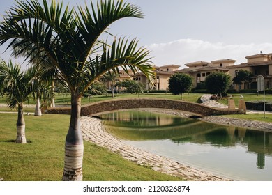New Cairo, Egypt - 11.21.2021: Beautiful lake and bridge at villas area at Madinaty compound, luxury living in Egypt
