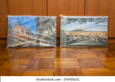 New canvas prints of landscape photos wrapped in protective bubble wrap.