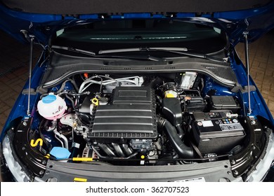 new car engine and parts under hood
