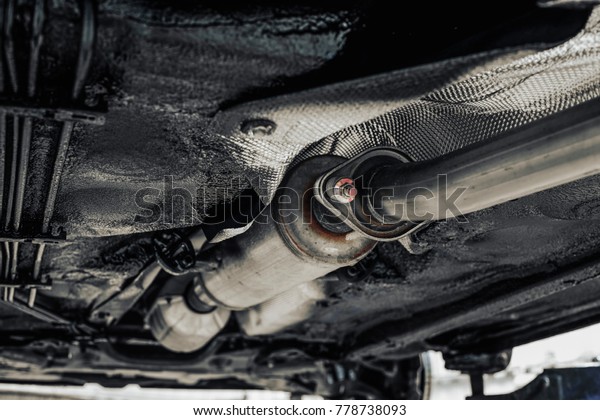new car\
exhaust system with shallow depth of\
field