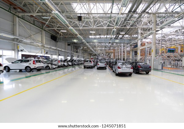 new car is at factory. Warehouse of cars. Modern
car Assembly at factory