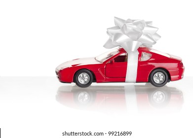 New Car Gift. Car With Bow Isolated On A White Background