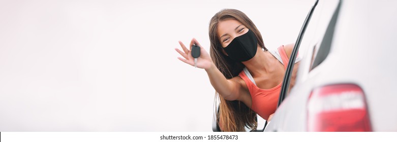 New Car Happy Asian Driver Woman Wearing Face Mask For Coronavirus Showing Keys With Pride. Drivers License Concept Panoramic Banner.