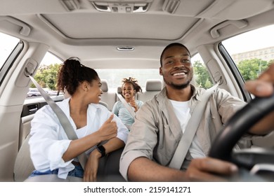 New Car. Happy Black Family Of Three Driving Own Car Gesturing Thumbs Up Approving Vehicle Sitting In Automobile. Road Trip On Vacation Concept. Selective Focus - Powered by Shutterstock