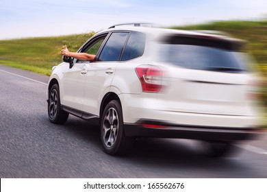 New Car Happy Owner Rides The Highway And Shows Thumb Up