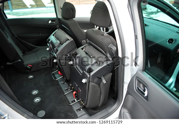 New car inside. Clean car\
interior. Black back seats transformer in sedan. Car cleaning\
theme.