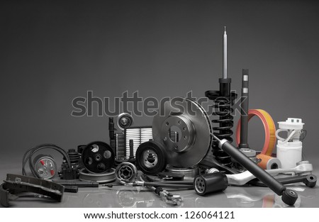 New car parts on a gray background