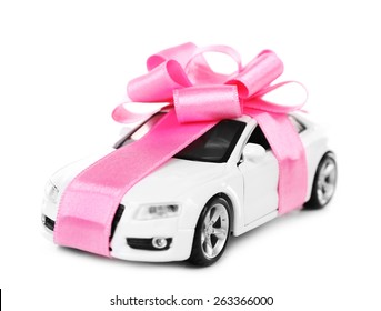 New Car With Pink Bow As Present Isolated On White