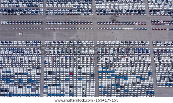 new car products line up in parking lot export for\
sale aerial view