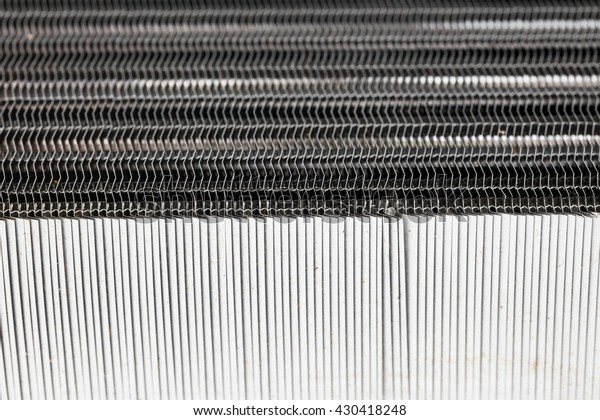 New car radiator heater isolated on white\
background. Metal honeycomb texture  radiator oil or water cooling\
engine. car parts.