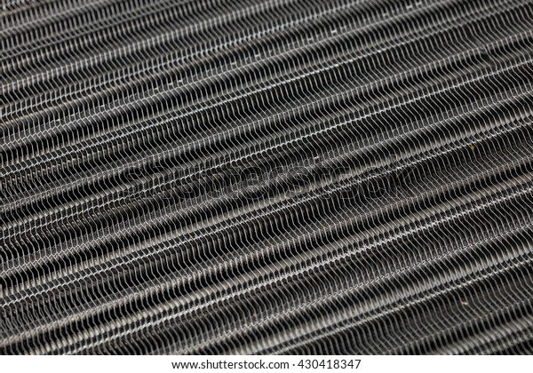 New car radiator heater isolated on white\
background. Metal honeycomb texture  radiator oil or water cooling\
engine. car parts.