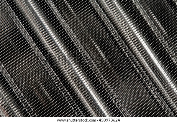 New\
car radiator heater isolated on white background. car spare parts.\
texture of the new engine water cooling\
radiators.