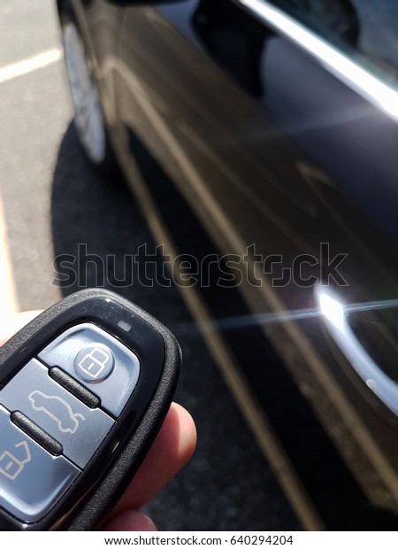 New Car Remote Control Key Keyless Entry Go against\
theft steal stolen the transport vehicle wit focus on the key in\
the hand