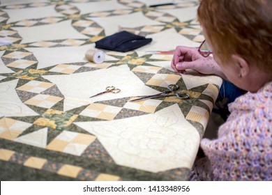 New Carlisle IN USA, March 17 2019; 
 During The Bendix Woods Sugar Camp Days, A Woman Works On A Decorative Quit During An Old Fashioned Quilting Bee Demonstration