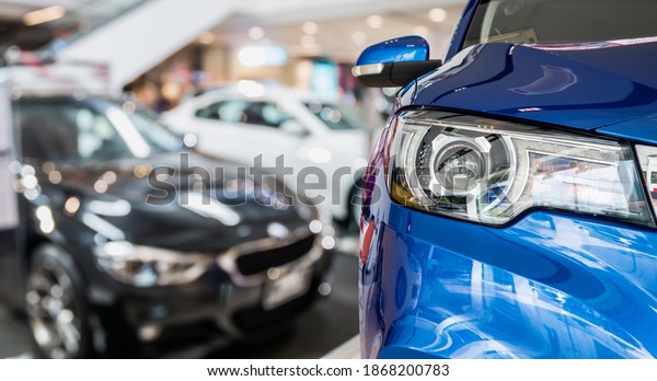 new cars in\
dealer showroom interior\
background