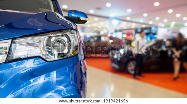 new cars in\
dealer showroom interior\
background