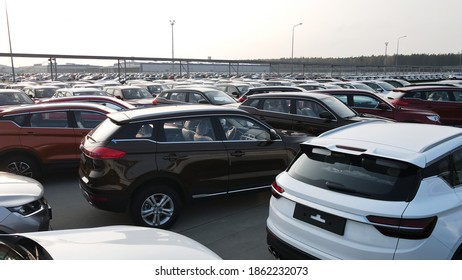 New Cars Lined Up Parking Outside Factory On Car Factory Background.