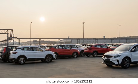 New Cars Lined Up Parking Outside Factory On Car Factory Background.