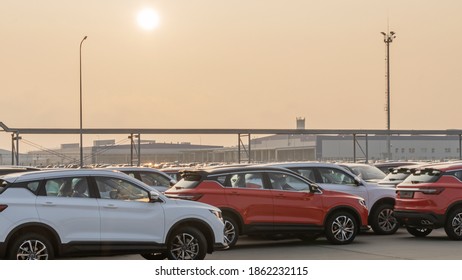 New Cars Lined Up Parking Outside Factory On Car Factory Background.