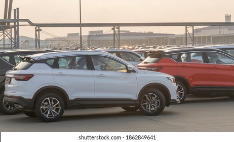 New Cars Lined Up Parking Outside Factory On Car Factory Background.