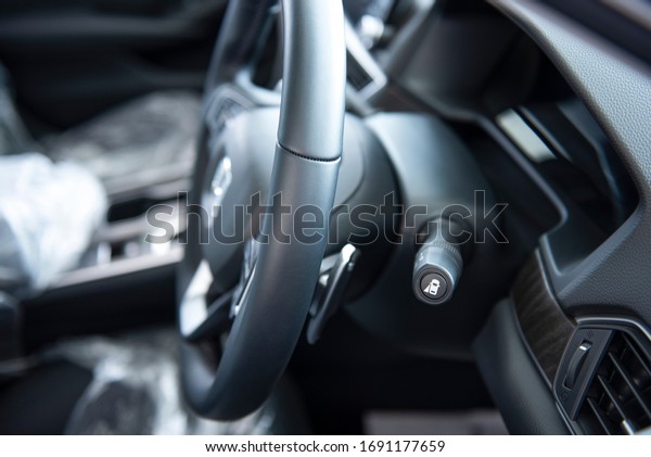 New cars in the luxury car interior
showroom Steering wheel, gear lever and control
panel