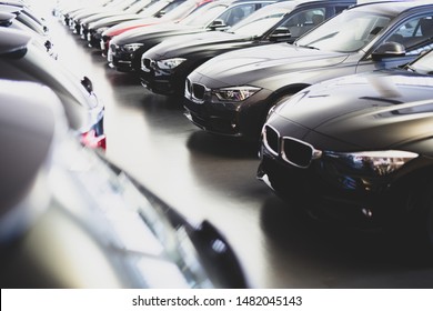 new cars in a row at the dealership
