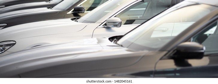 new cars in a row at the dealership